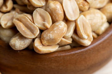 Peeled and roasted peanuts on the table