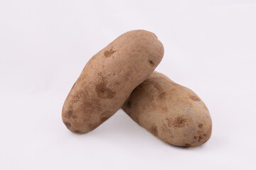 Two potatoes on white - 551965294