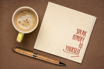 speak kindly to yourself - inspirational reminder on a napkin with a cup of coffee, personal development concept - obrazy, fototapety, plakaty