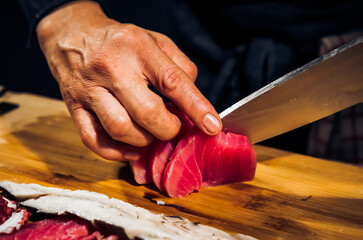 Sashimi Japanese food, Sashimi set. Salmon, wasabi, fish, shrimp,octopus, sashimi, hirame, salmon sashimi and tuna sashimi, Japanese food concept, with copy space. Dark Tone