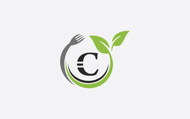 Green leaf food logo with spoon and healthy logo design image spoon fork and leaf