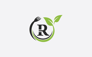 Green leaf food logo with spoon and healthy logo design image spoon fork and leaf