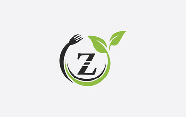 Green leaf food logo with spoon and healthy logo design image spoon fork and leaf