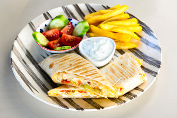 Lavash doner kebab ( zurna doner durum )  or shawarma sliced in plate isolated. 