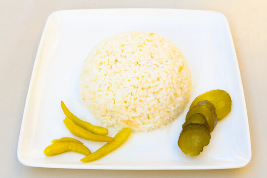 Traditional turkish bulgur pilaf with tomato sause in plate (Turkish name; bulgur pilavi, meyhane pilavi) Pirinc pilavi. Pilavustu tavuk, nohut, kuru fasulye, ciger.