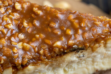 Cheesecake made of dairy products and peanuts in caramel