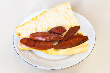 Grilled chili, tomato and sucuk between bread. ( Sucuk ekmek ) 
