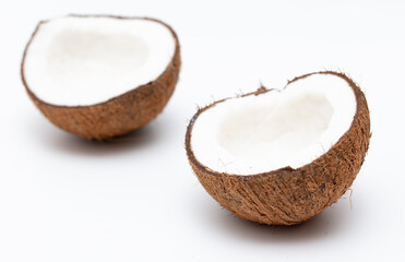 Cracked coconut nut isolated on white background.