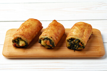 Banquet table with variety of stuffed pies pastry