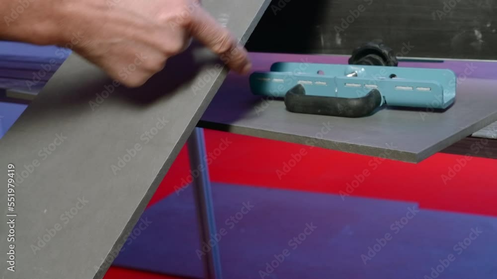 Poster man cut board on machine smoothly. creative. carpenter is satisfied with smooth cut of board on mach