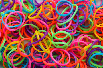 Colorful office rubber bands as background, closeup