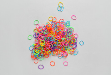 Heap of office rubber bands on white background