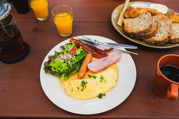 breakfast set with omelet,sausage and salad on the morning time