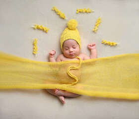 Сute little newborn baby girl in beautiful decor antourage