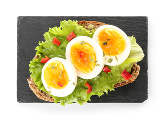 Board delicious toast with boiled egg on white background