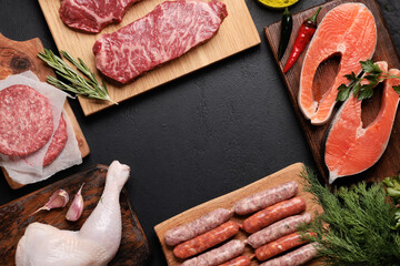 Various raw meat and fish. Steaks, sausages, salmon, chicken and spices