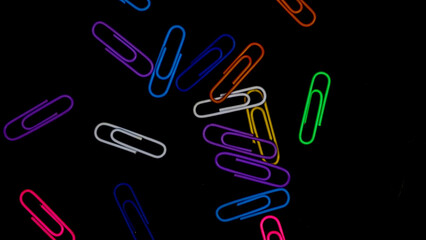 Paper clip isolated on a black background