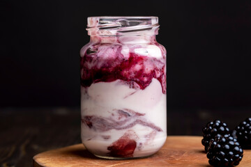 Fresh delicious milk yogurt with blackberry flavor