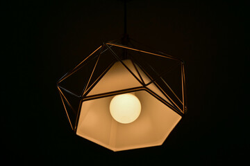 Lighting that consists of triangular frames that form a hexagonal shape