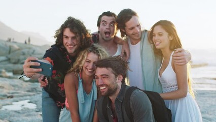Phone selfie, comic and friends at the beach for adventure, travel and outdoor streaming on holiday in Brazil. Mobile, crazy photo and funny men and women at the ocean for a vacation as a group