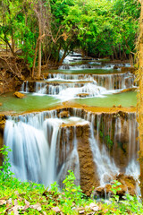 Amazing colorful waterfall in national park forest during spring,beautiful deep forest in Thailand,technic long exposure, during vacation and relax time.