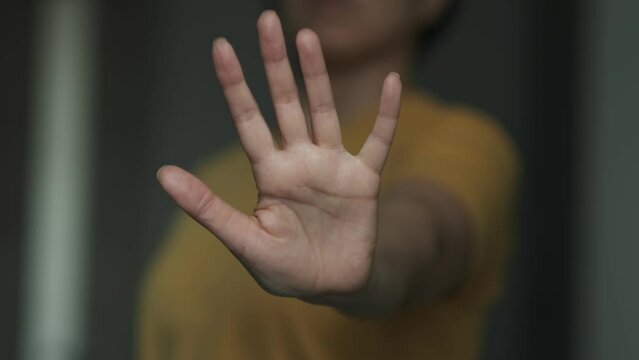unrecognizable woman's hand showing reject. Stop violence against and sexual abuse women,anti-trafficking and stopping violence against women, International Women's Day. Stop, break, pause gesture