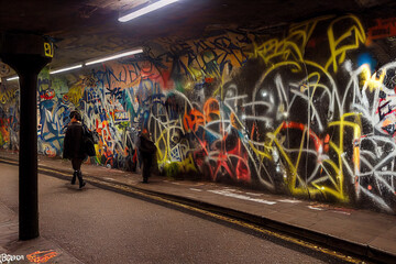 Graffiti covering urban wall in city