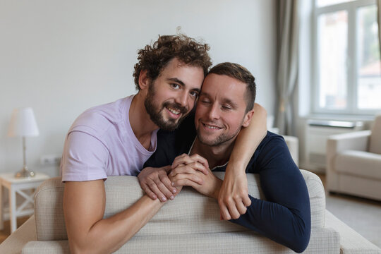 Portrait of Carefree Gay Couple Indoors. Happy gay couple spending time together