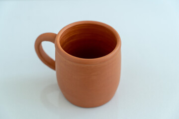 Ceramics, a ceramic product made with their own hands on a potter's wheel, a mug.