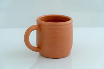 Ceramics, a ceramic product made with their own hands on a potter's wheel, a mug.