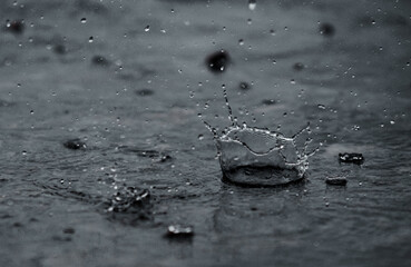 Rain water drop falling to the floor in heavy rain day