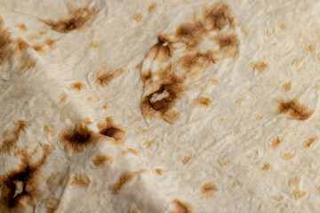 Wheat pita bread with dark spots