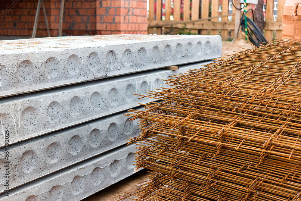 Poster reinforced concrete floor slabs are stored at the construction site. close-up. reinforced concrete b