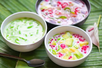 Thai dessert - Thai rice flour pandan leaf cantaloupe jelly mixed fruit with coconut milk and syrup sweets dessert on bowl, Asian food - top view