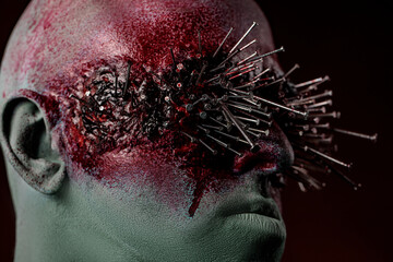 Demon man with spikes on the eyes. Halloween concept makeup