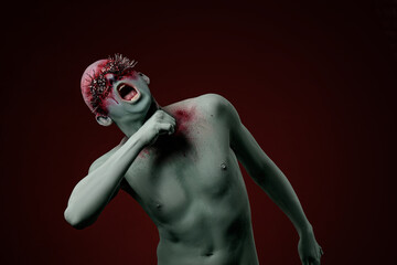 Demon man with spikes on the eyes. Halloween concept makeup