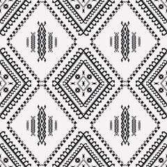 Fototapeta premium Ethnic tribal black and white pattern. Vector ethnic tribal aztec Navajo geometric diamond shape seamless pattern background. Southwest geometric pattern for fabric, home interior decoration elements.