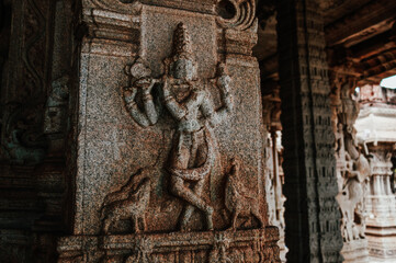 Closeup of lord krishna carving at The Vittala Temple or Vitthala Temple in Hampi Pillar architecture . unesco world heritage site. 