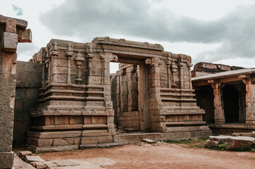 Fototapeta premium Beautiful stone Entrance carving architecture at hampi, Karnataka.