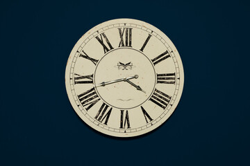 Front view of the dial of a vintage wall clock. Antique imitation. Monograms are modified and not...
