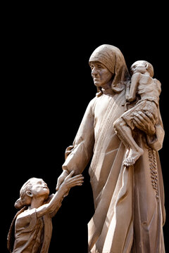 Mother Teresa statue with poor children,  Saint Mother Teresa of Calcutta