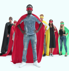 stylish guy in a superhero Cape standing in front of his team