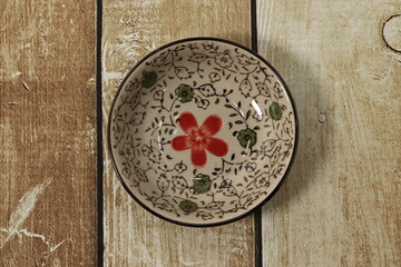 Beautiful Vintage Style Bowl on a Wooden Background
