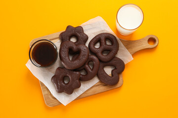 Concept of tasty bakery, gingerbread cookies in chocolate, top view