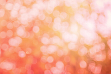 Natural background blurring warm colors and bright sun light. Bokeh or Christmas background Green Energy at sky sunny color orange light patterns plain abstract flare evening clouds blur.	