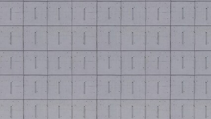 the path is paved with gray concrete rectangular dirty brick, pedestrian lane made with classical bricks wall, texture