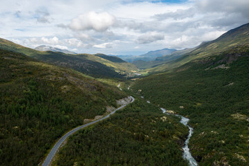 aerial view of a road to the mountains