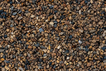 Natural smooth river pebbles stone grain texture and Grunge, pebble floor image. Blank wallpaper abstract stone backdrop for background or product design graphic artwork and interior design