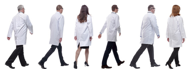 group of doctors in motion isolated on white