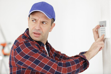 men regulates temperature on the wall